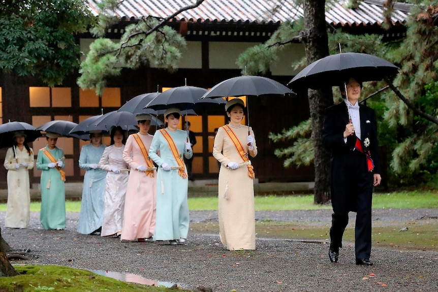 Japan's Crown Prince Akishino and Crown Princess Kiko arrive in colourful dresses to the enthronement ceremony.