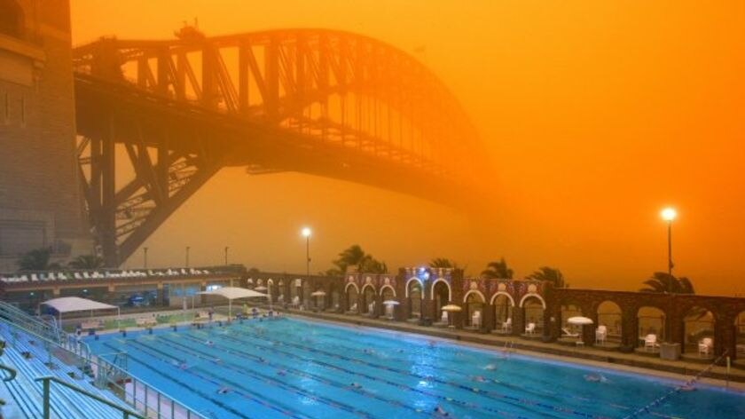 Eerie glow: The Sydney Harbour Bridge is bathed in dust