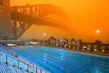 Eerie glow: The Sydney Harbour Bridge is bathed in dust