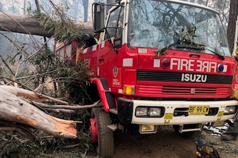 A fire trick hit by a tree.