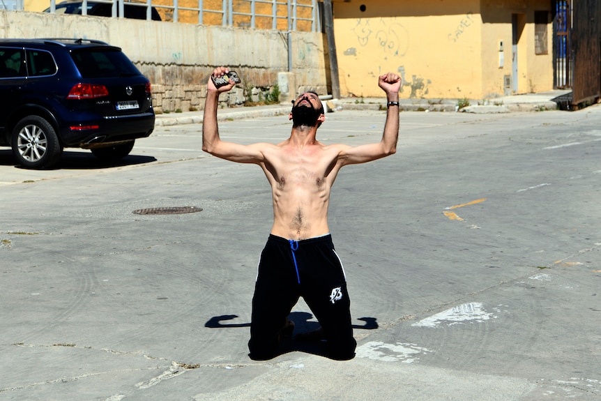 A man from Morocco reacts after swimming into the Spanish territory.