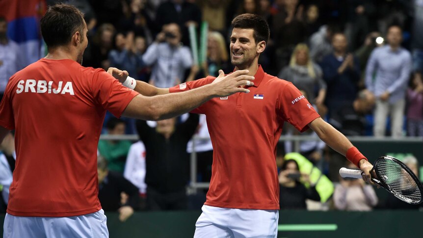 Serbia's Novak Djokovic (R) and Nenad Zimonjic celebrate a Davis Cup win over Croatia in Kraljevo.