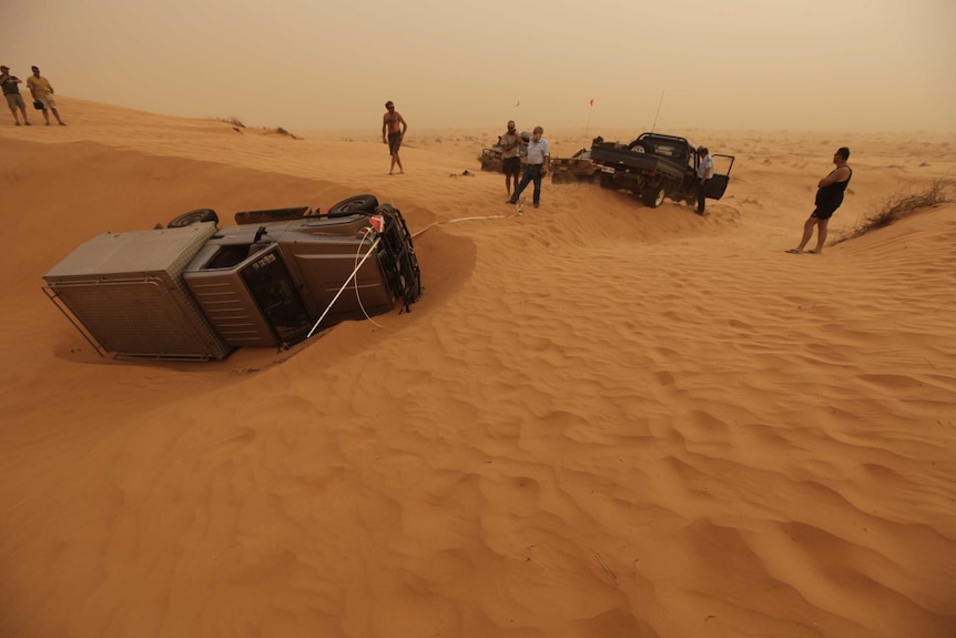 Emergency services help rescue a tourist who got stuck in the Simpson Desert