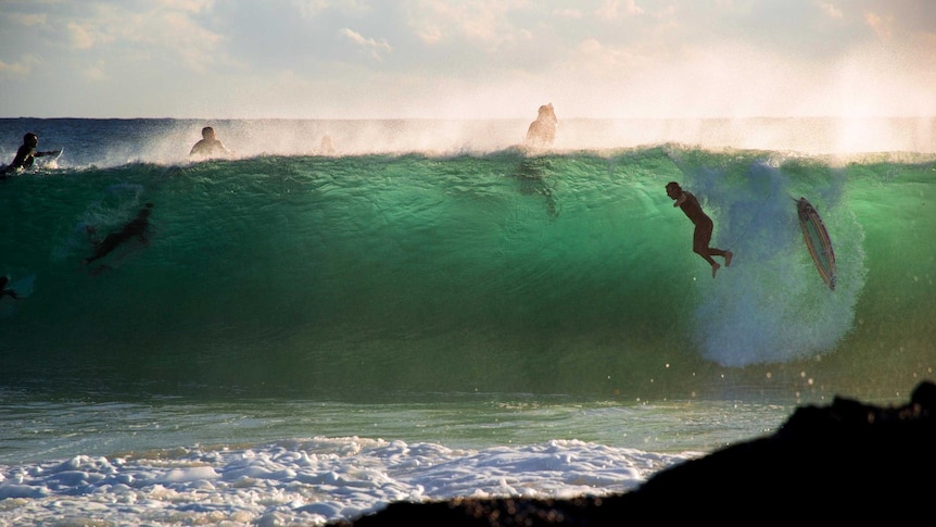Surfers battle the waves at Snapper Rocks on Queensland's Gold Coast.