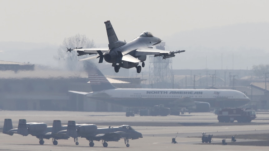 A United States Air Force F-16 fighter jet takes off at a base in Osan in South Korea.