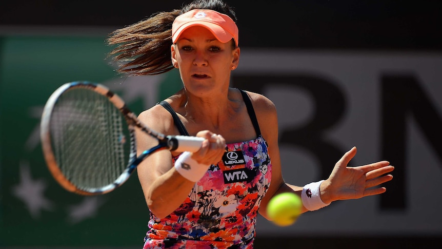 Agniezska Radwanska plays a shot at French Open