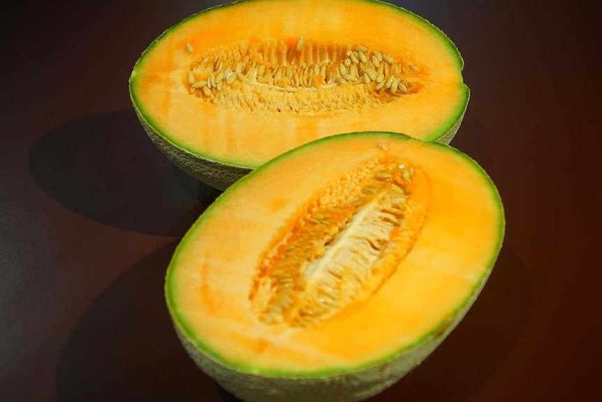 A rockmelon cut in half.