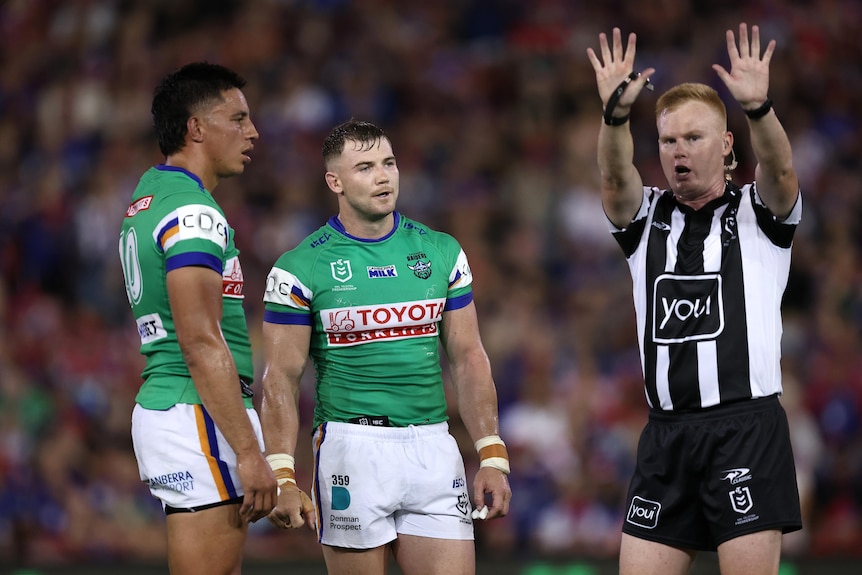 The referee signals 10 to send Canberra Raiders' Hudson Young to the sin bin in an NRL game.