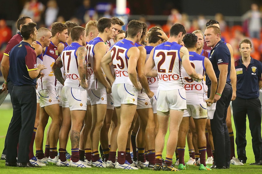 Justin Leppitsch addresses Brisbane Lions players during QClash