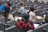 Students sitting in a lecture theatre