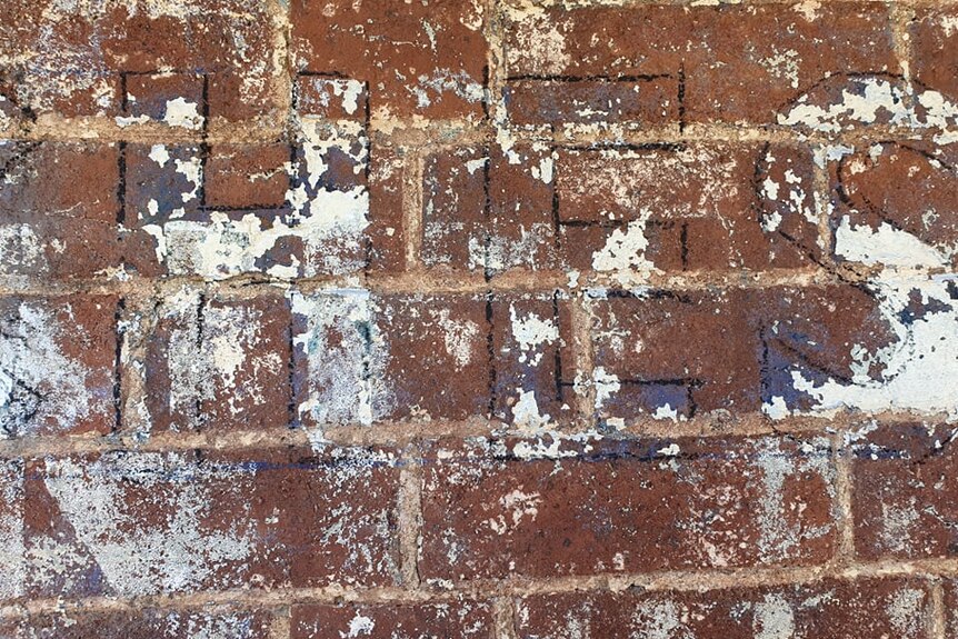 Letters drawn on a brickwall.