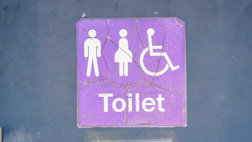 Sign to public toilets, male, female and accessible toilets.