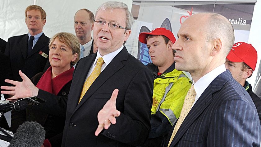 Kevin Rudd takes questions from the media as Mark Arbib stands to his side on June 10, 2009.