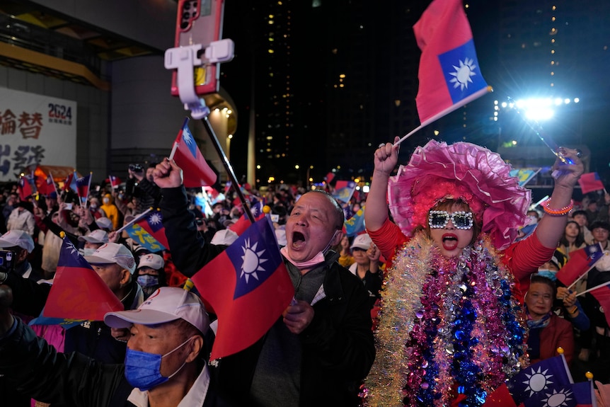 People wave Taiwanese flags