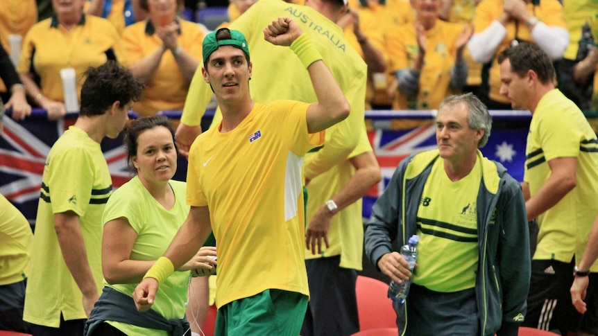 Australia's Thanasi Kokkinakis celebrates a win over Czech Republic's Lukas Rosol in Davis Cup.
