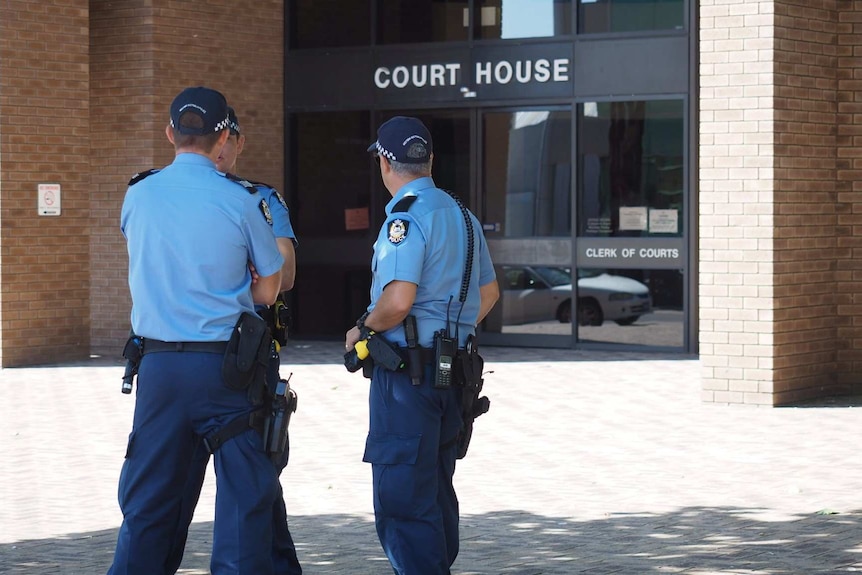 Three uniformed police officers standing outside the Bunbury court house