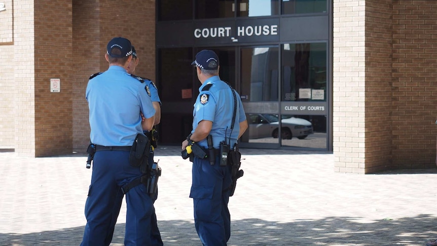 Three uniformed police officers standing outside the Bunbury court house