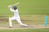 Sri Lanka's Kumar Sangakkara cuts against the Chairman's XI at Manuka Oval.