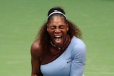 A female tennis player screams while wearing a purple tutu
