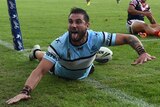 Jack Bird celebrates his try against the Roosters