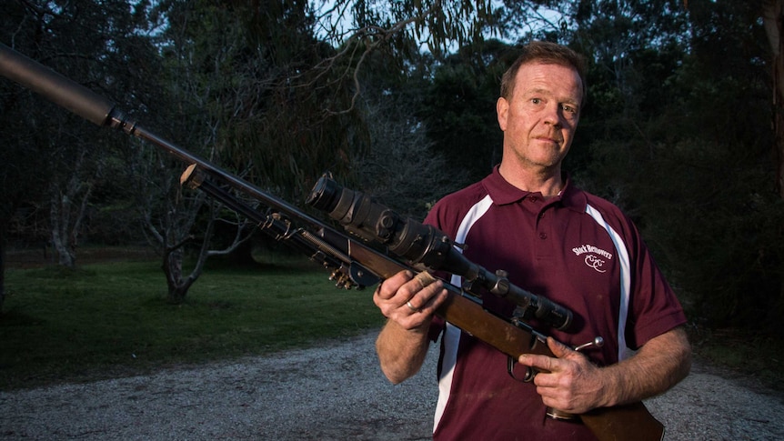 Professional shooter Dave Rolland with his hunting rifle in hand getting ready for a shoot.