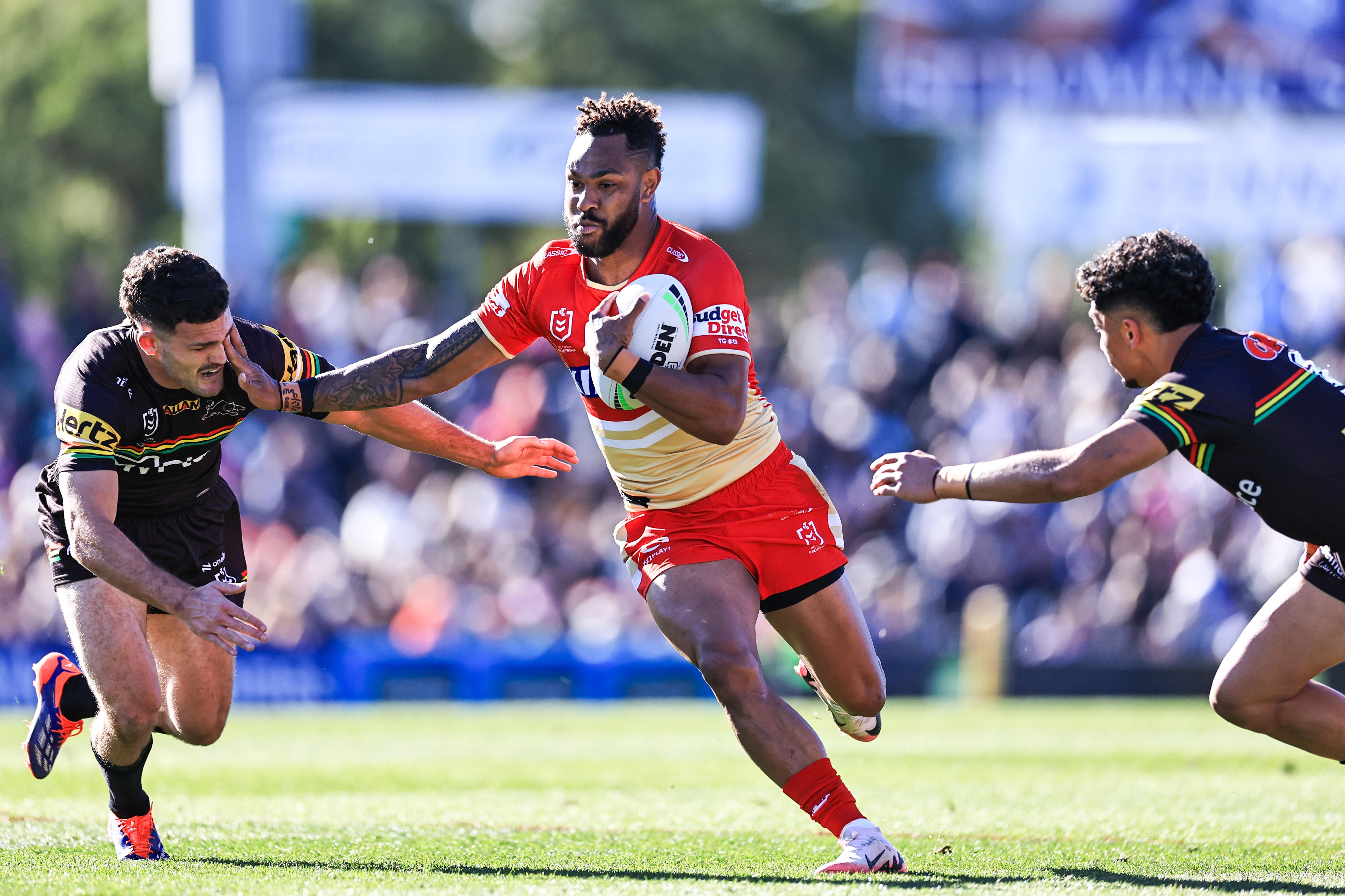 Hamiso Tabuai-Fidow of the Dolphins runs with the ball during the NRL Round 20 match between the Penrith Panthers