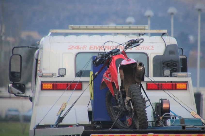 A motorcycle on the back of a truck.