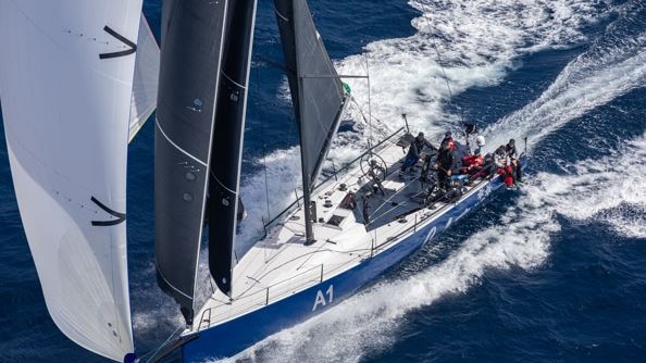 An aerial shot of a yacht racing.