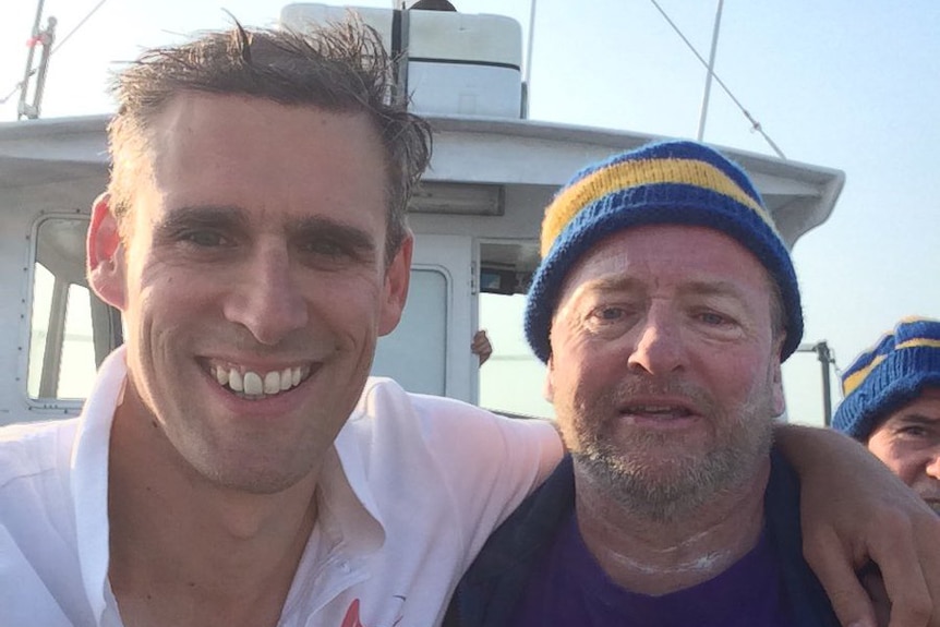 Coach Tim Denyer with Brisbane amputee swimmer Michael Powell after he crossed the English Channel