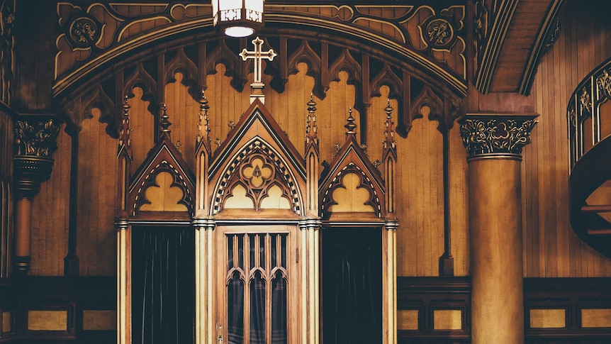Confessional inside church, wooden interior