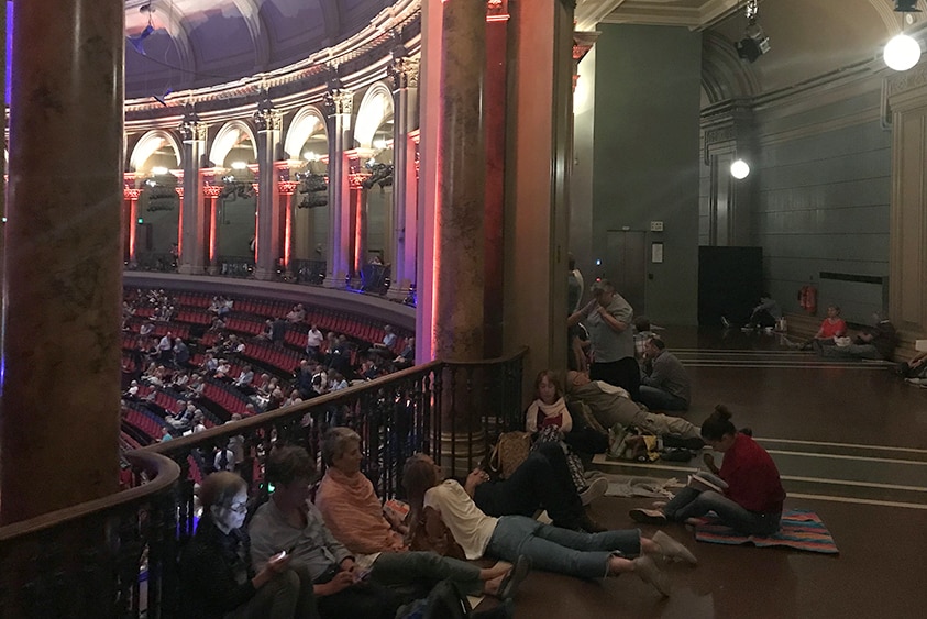 The gallery level of the Royal Albert Hall with BBC Proms audience spread out on the floor