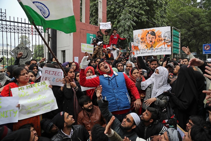 Indian students of the Jamia Millia Islamia University shout slogans during a protest, in New Delhi, India.