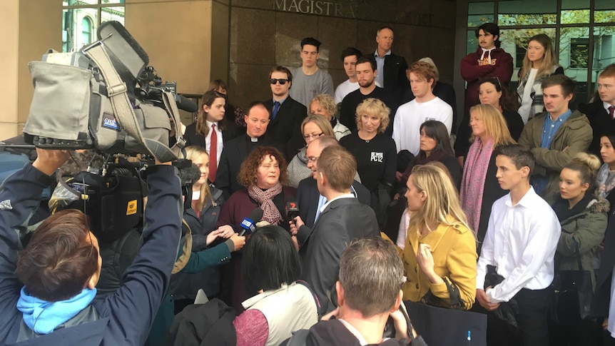 Patrick Cronin's parents surrounded by supporters outside court