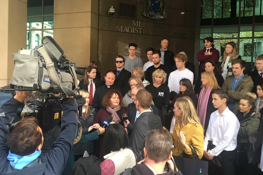 Patrick Cronin's parents surrounded by supporters outside court