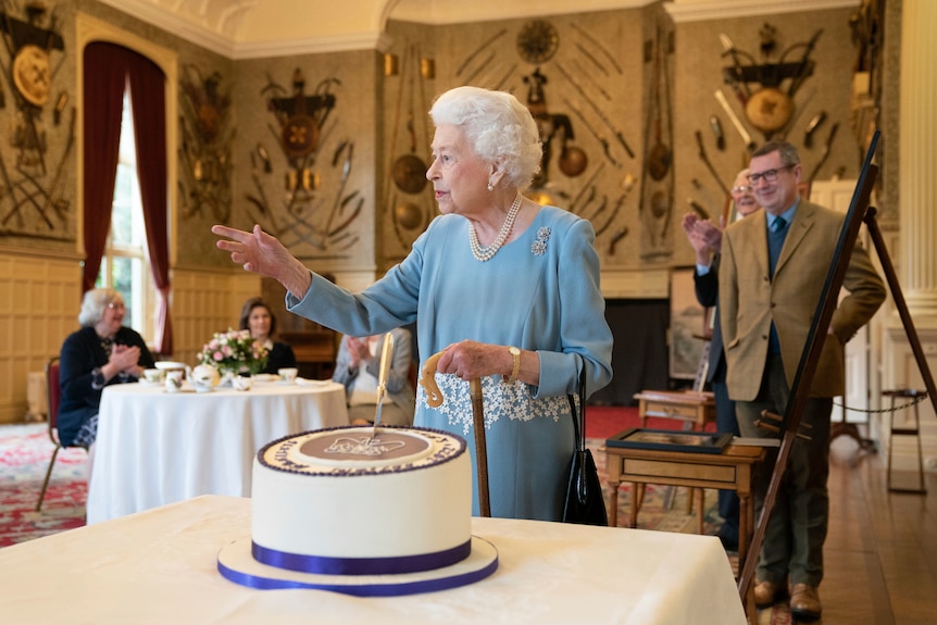 Queen Elizabeth cuts a cake to celebrate the start of the Platinum Jubilee in Norfolk, England, February 5, 2022.