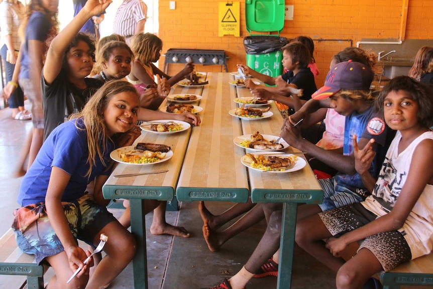 Children eat lunch at Lajamanu school