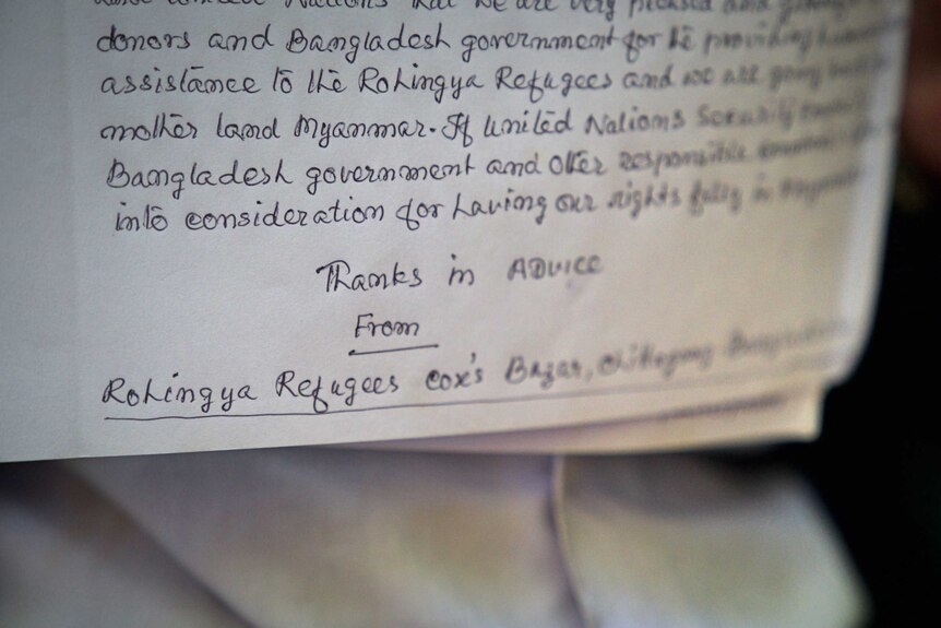 A closeup of a handwritten letter to the Bangladeshi Prime Minister.