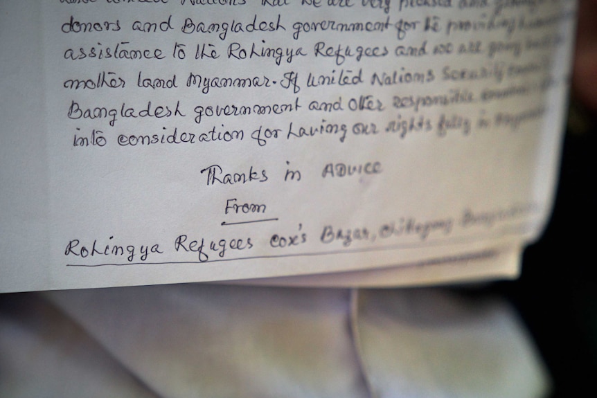 A closeup of a handwritten letter to the Bangladeshi Prime Minister.