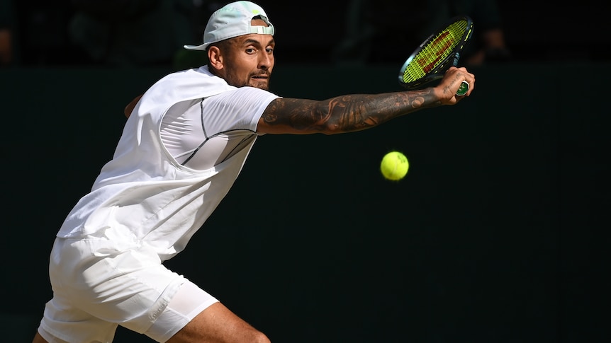 Nick Kyrgios wearing white sports attire hitting a tennisball