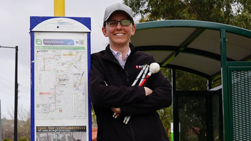 Software programmer Cassie Hames at an Adelaide bus stop.