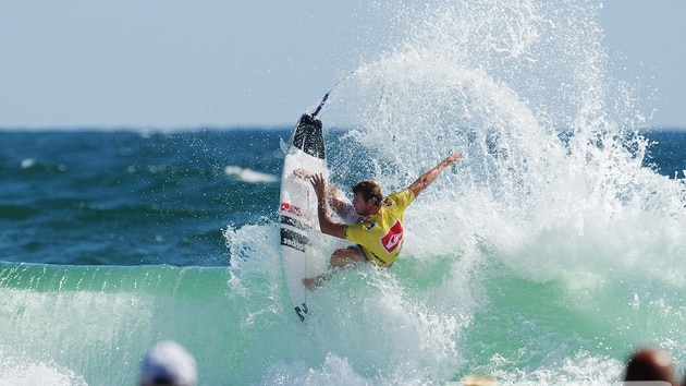 Taj Burrow snapping off the lip at Snapper Rocks