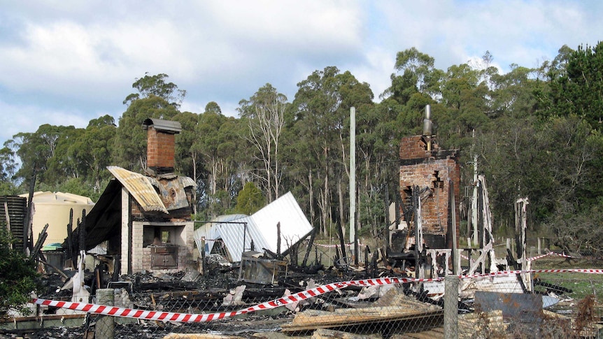 Burnt out house in Winkleigh, northern Tasmania, where a gun safe was found open in ruins.