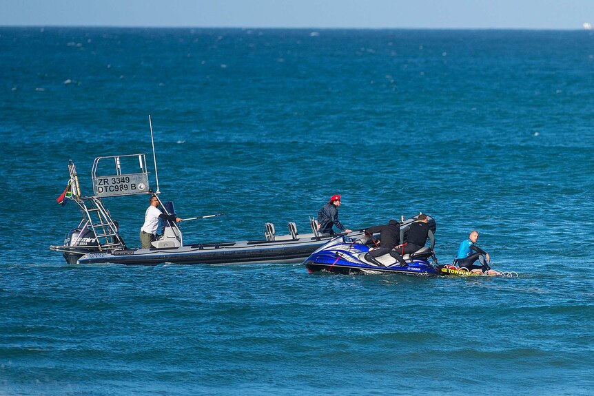 Mick Fanning rescued by jet ski after shark attack