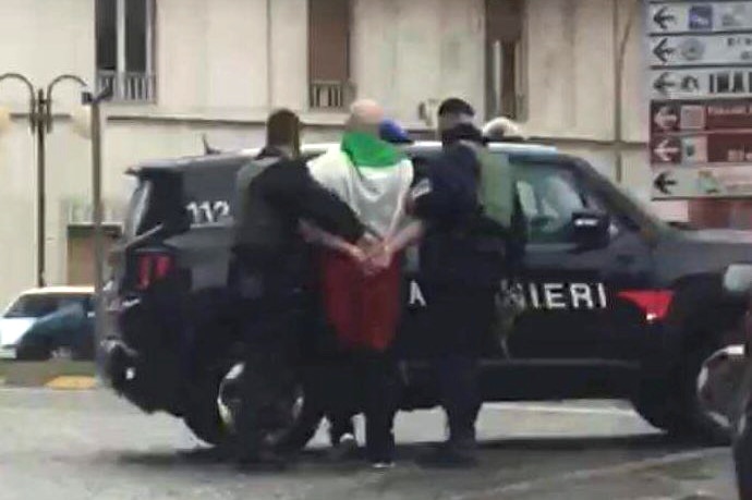 Man wearing Italian flag arrested