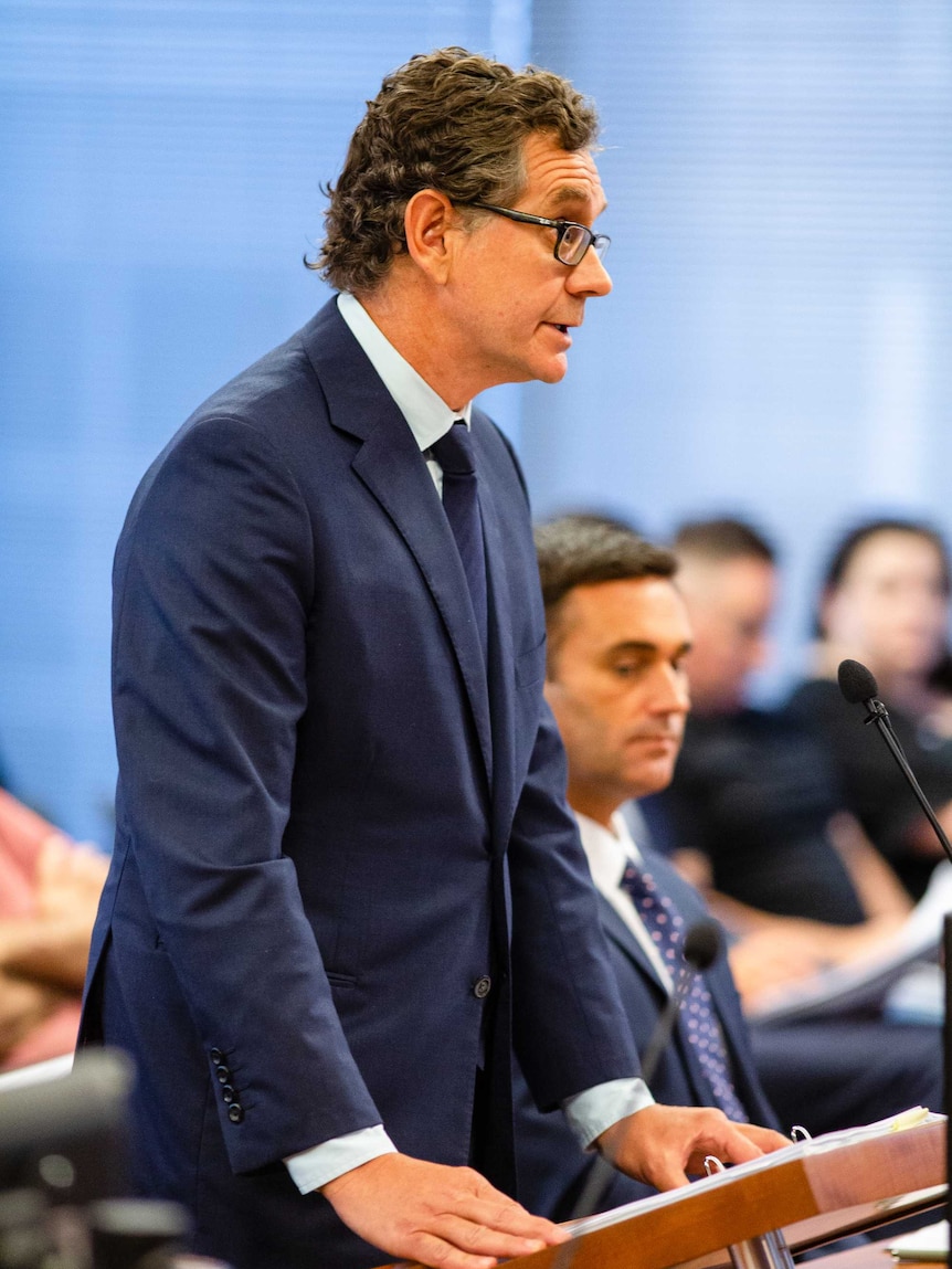 A man speaking in a court room.