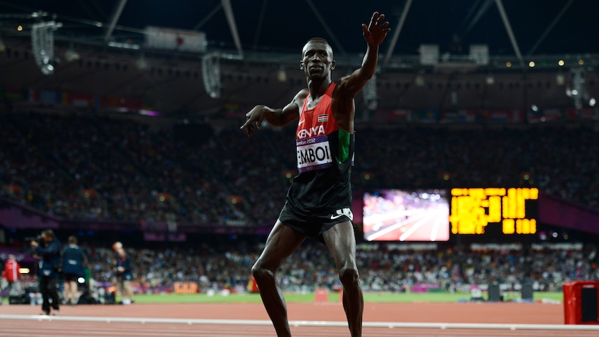 Kenya's night ... Ezekiel Kemboi celebrates after winning the men's 3000m steeplechase.