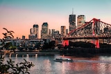 A photograph of the Story Bridge in Brisbane taken at dusk.