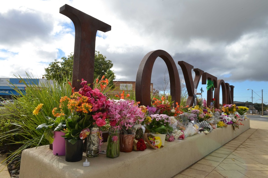 Flowers left at Loxton sign for Kirsty Boden.