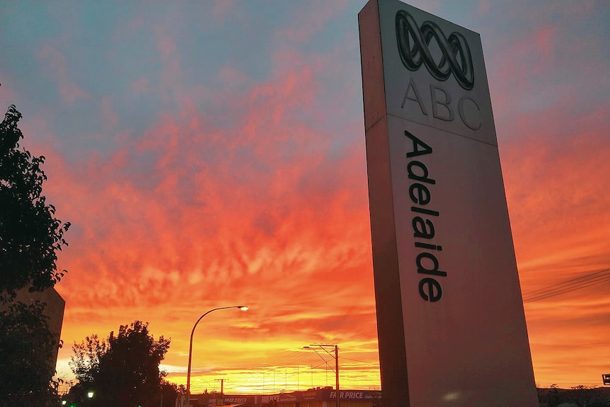 The sign outside ABC Adelaide with sunset in background