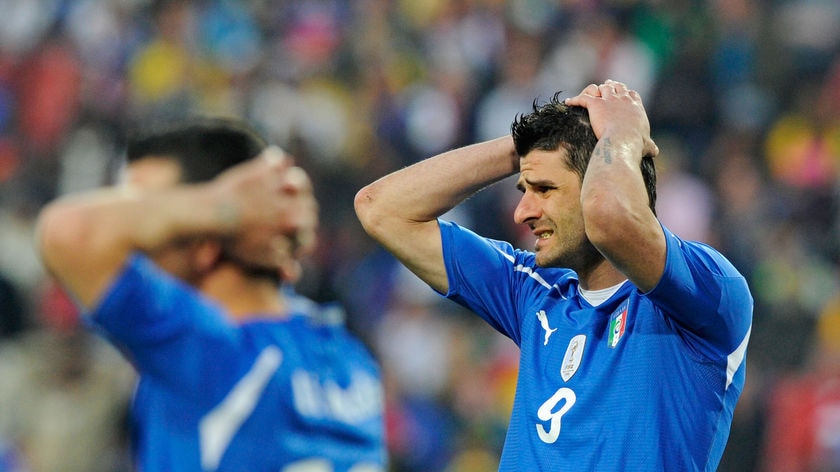 Nightmare end: Italy scored two late goals but could not find the crucial equaliser to secure passage to the knock-out stages.